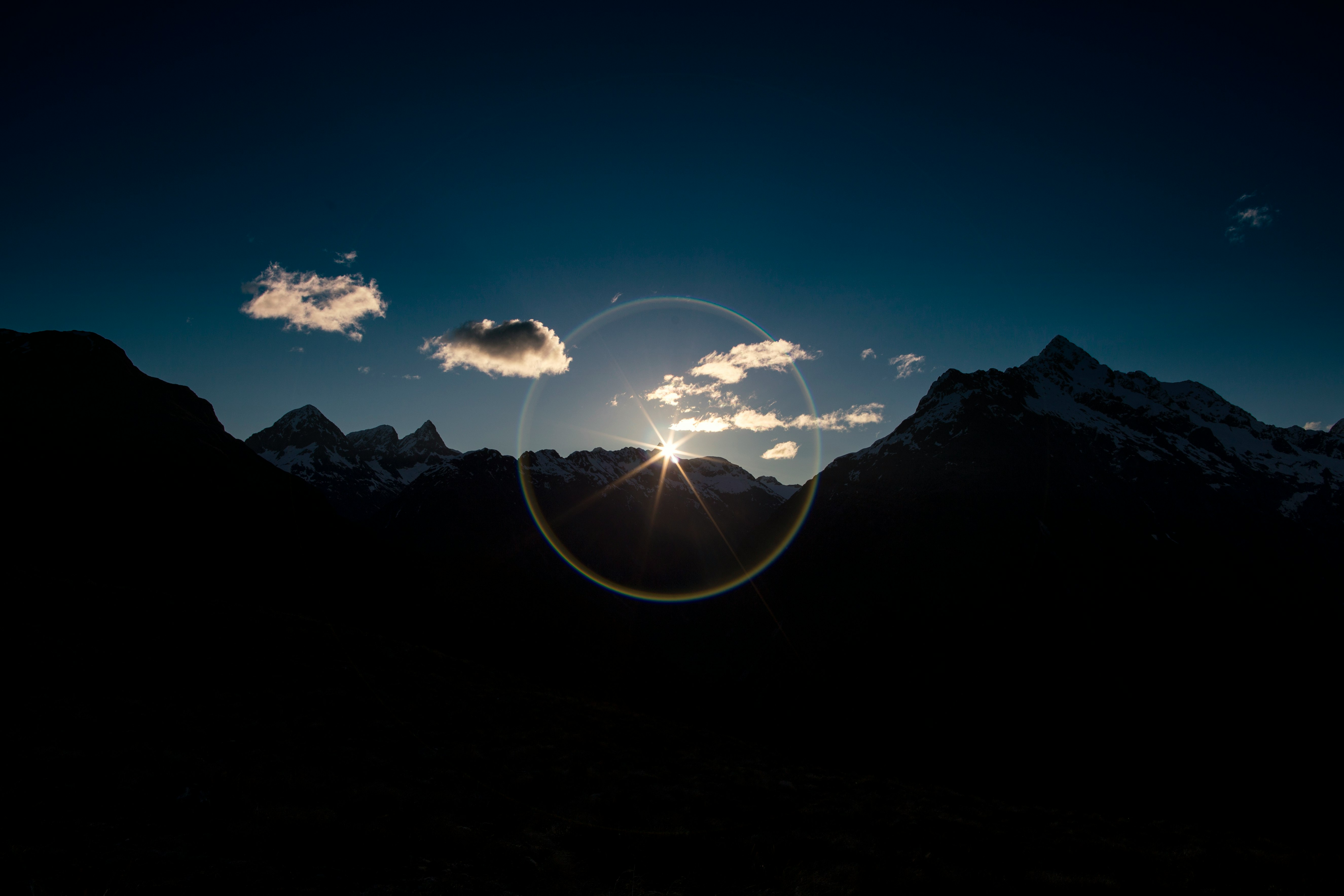 silhouette of mountains during golden house